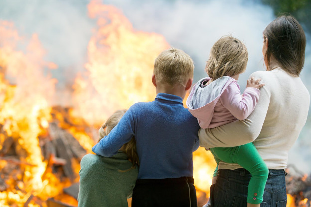 Family watching home in fire