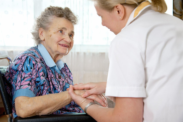 Healthcare worker responding to patients question