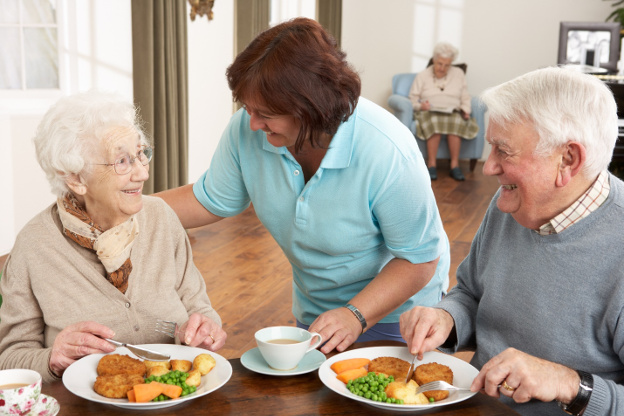 Nurse serving patients food